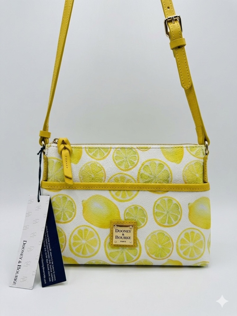 Dooney & Bourke “Citrus Delight” Limone Ginger Pouchette Crossbody. NWT.